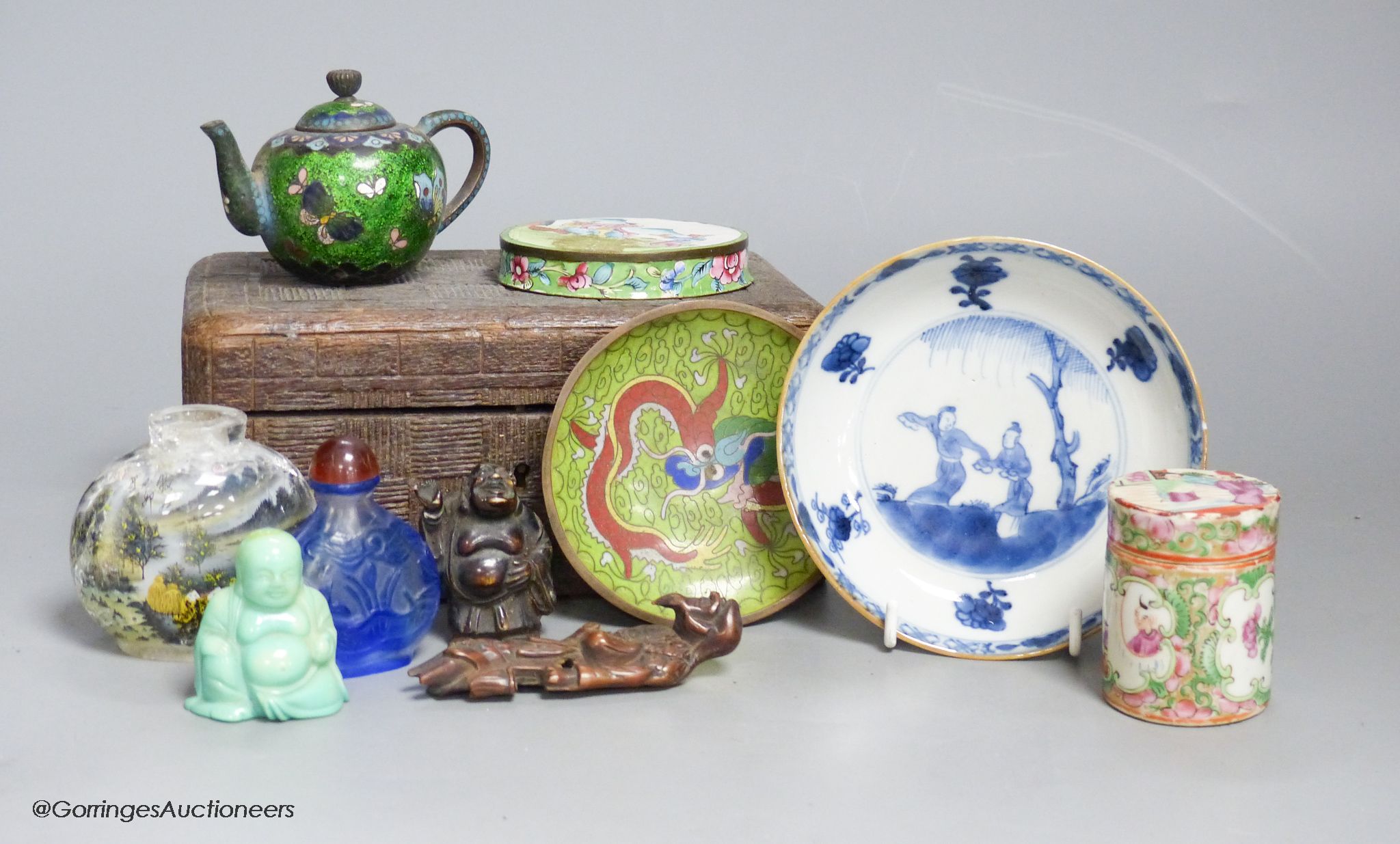 A small miscellaneous Oriental collection including enamel snuff boxes, Buddha carvings etc.